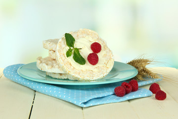 Tasty crispbread with berries, on white table