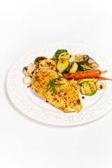 Grilled chicken breasts and vegetables