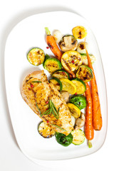 Grilled chicken breasts and vegetables