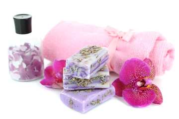 Sea salt, soap and orchid isolated on white