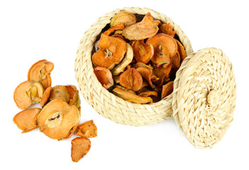 Dried apples in wicker basket, isolated on white