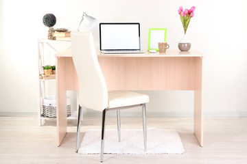 Workplace at home with laptop, close up