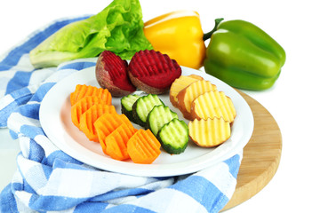 Fototapeta na wymiar Beautiful sliced vegetables, on cutting board, isolated on