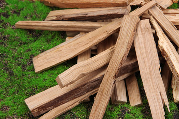 Stack of firewood on grass close up