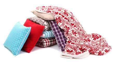 Warm plaids and pillows isolated on white