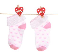 Socks hanging on clothesline isolated on white