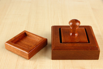 Wooden stamp on wooden background