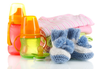 Composition with crocheted booties for baby, isolated on white