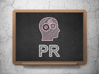 Marketing concept: Head With Gears and PR on chalkboard