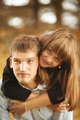 Obraz premium embracing and kissing young guy and girl on nature