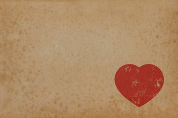 Red heart on vintage paper with copyspace