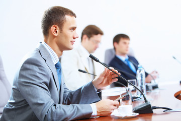 Three businesspeople at meeting