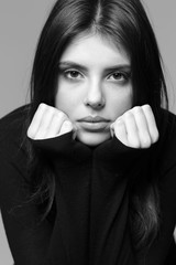 Black and white closeup portrait of a thoughtful woman