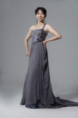 beautiful smiling girl in a gray wedding dress posing