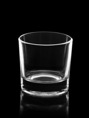 empty small shot glass isolated on black