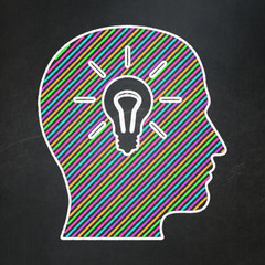Marketing concept: Head With Light Bulb on chalkboard background