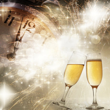 Champagne glasses, clock and fireworks