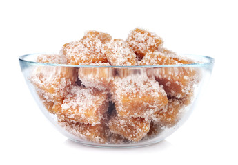 glass bowl with homemade candy from quinces isolated on white