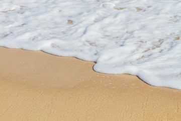 Wave of the sea on the sand beach