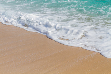 Wave of the sea on the sand beach