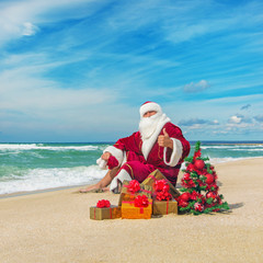 Santa Claus at sea beach with many gifts and decorated christmas