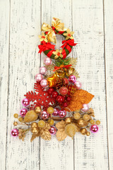 Fototapeta na wymiar Christmas tree of Christmas toys on wooden table close-up