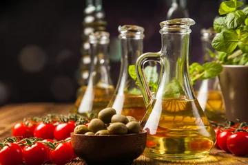 Foto op Canvas Composition of olive oils in bottles © BrunoWeltmann