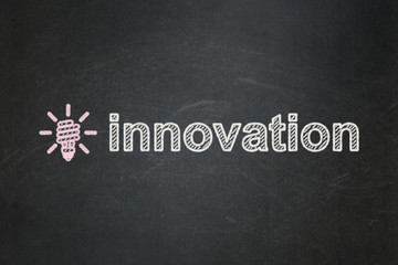 Finance concept: Energy Saving Lamp and Innovation on chalkboard