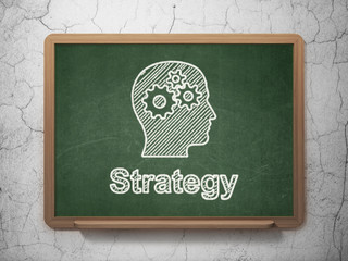 Business concept: Head With Gears and Strategy on chalkboard
