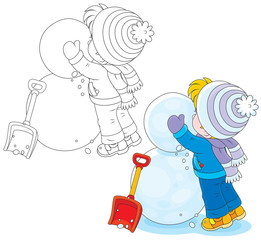 Child makes a snowman from big snowballs