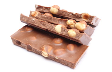 Closeup of chocolate pieces on white background
