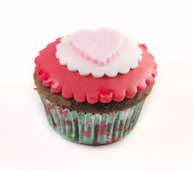 The red cupcake isolated on white background