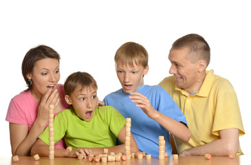 Happy family playing at table