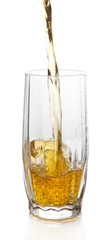 Juice pouring into glass isolated on white