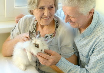 Senior couple with a rabbit