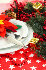 Christmas table setting with festive decorations close up