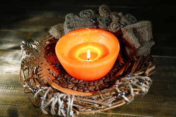Burning candle with Christmas decorations
