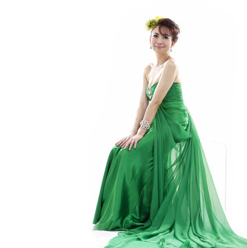 Beautiful Bride In A Green Wedding Dress Sitting In Studio