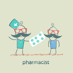 pharmacist gives the patient a tablet