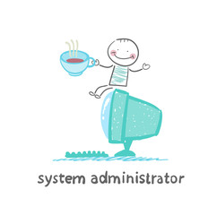 system administrator at the computer drinking coffee