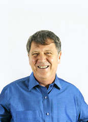 Fototapeta premium Portrait of a confident senior man standing on white background