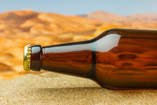 bottle of beer in desert