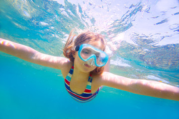 snorkeling blond kid girl underwater goggles and swimsuit
