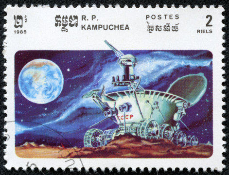 stamp shows moonwalker explores the lunar craters