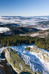 View of a low clouds on winter mountain ridge - Jeseniky hills