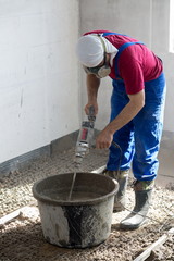 Worker prepare the mixture to pour the floor