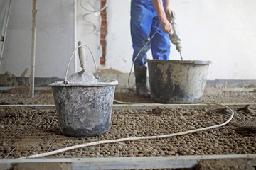 Room with expanded clay aggregate on floor and worker