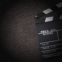 Movie production clapper board over dark textured background
