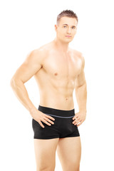 Fototapeta premium Young shirtless man looking at camera