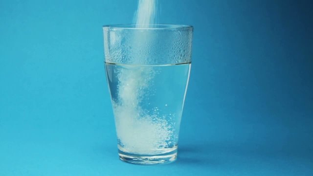 Flu Medicine Powder Dissolving in Water